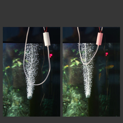 USB aquarium air pump running in a fish tank producing bubbles