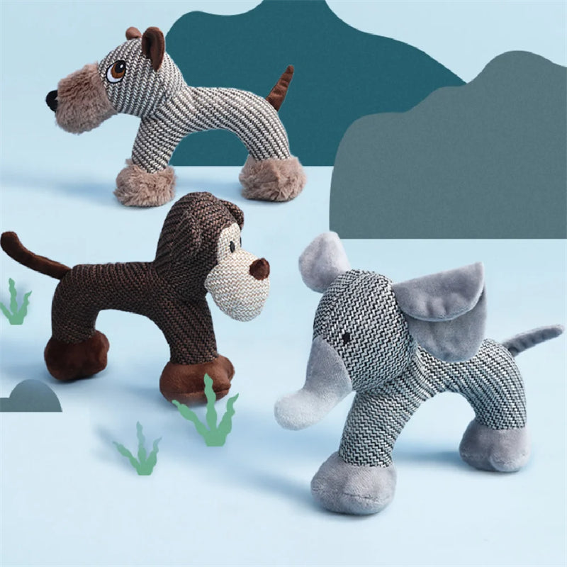 Plush squeaky dog toys shaped like a dog, monkey, and elephant