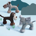 Plush squeaky dog toys shaped like a dog, monkey, and elephant