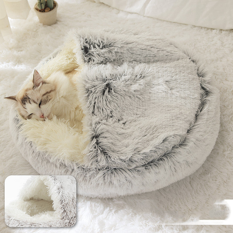 Cat sleeping in plush cat bed